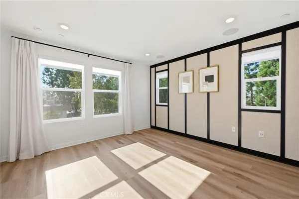 a view of a house with potted plants
