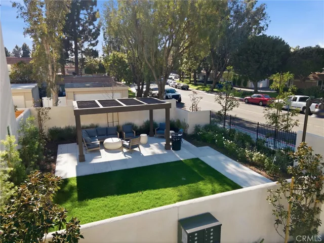 a view of yard with patio and outdoor seating