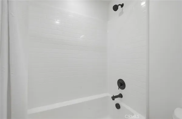 a view of a patio with couches chairs and a big yard