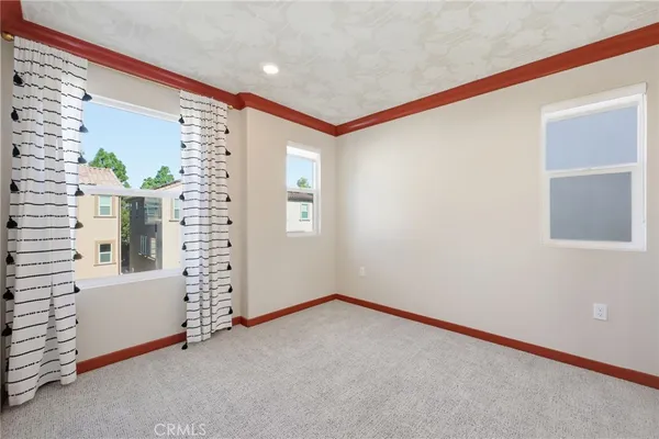 a view of a hallway with white doors