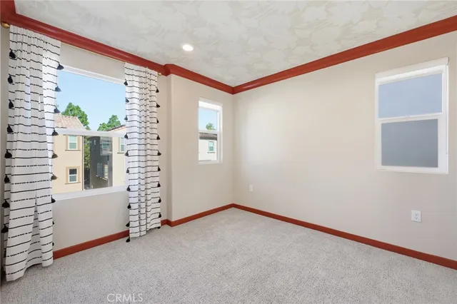 a view of a hallway with white doors