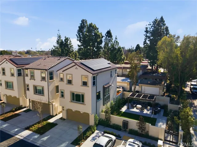 a roof deck with table and chairs a barbeque
