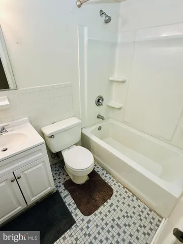 a bathroom with a toilet and a bathtub