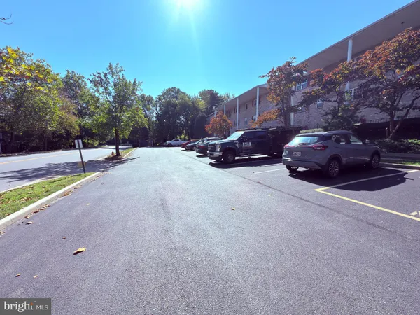 a view of street with parked cars