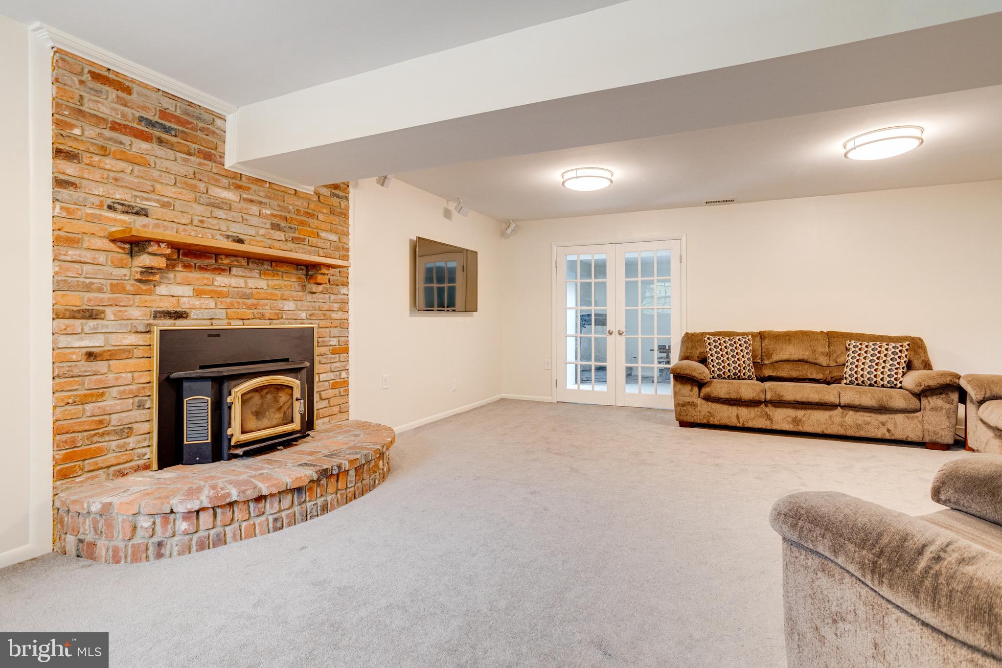 7704 Pecan Leaf Road Severn, MD 21144 - Photo 42 of 67 Lower level Family Room with fireplace!
