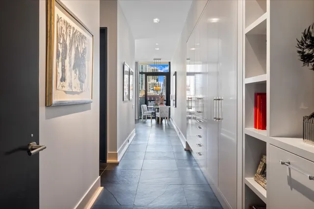 a dining room with furniture and a window