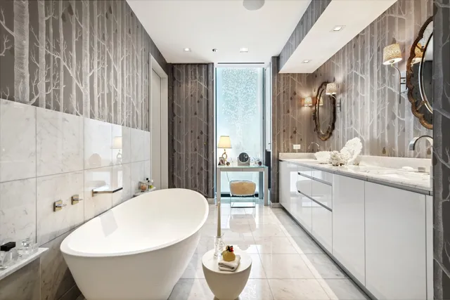 a bedroom with a bed couch and a window