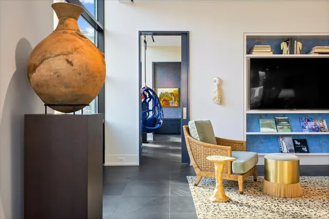 a dining room with furniture and wooden floor