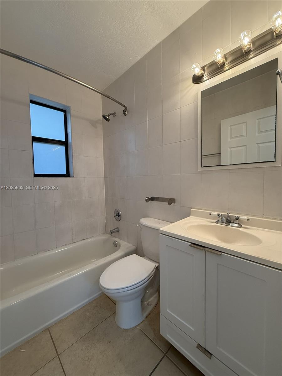 421 Southwest 6th Street, Unit 7 Miami, FL 33130 - Photo 7 of 8 a bathroom with a sink toilet and shower