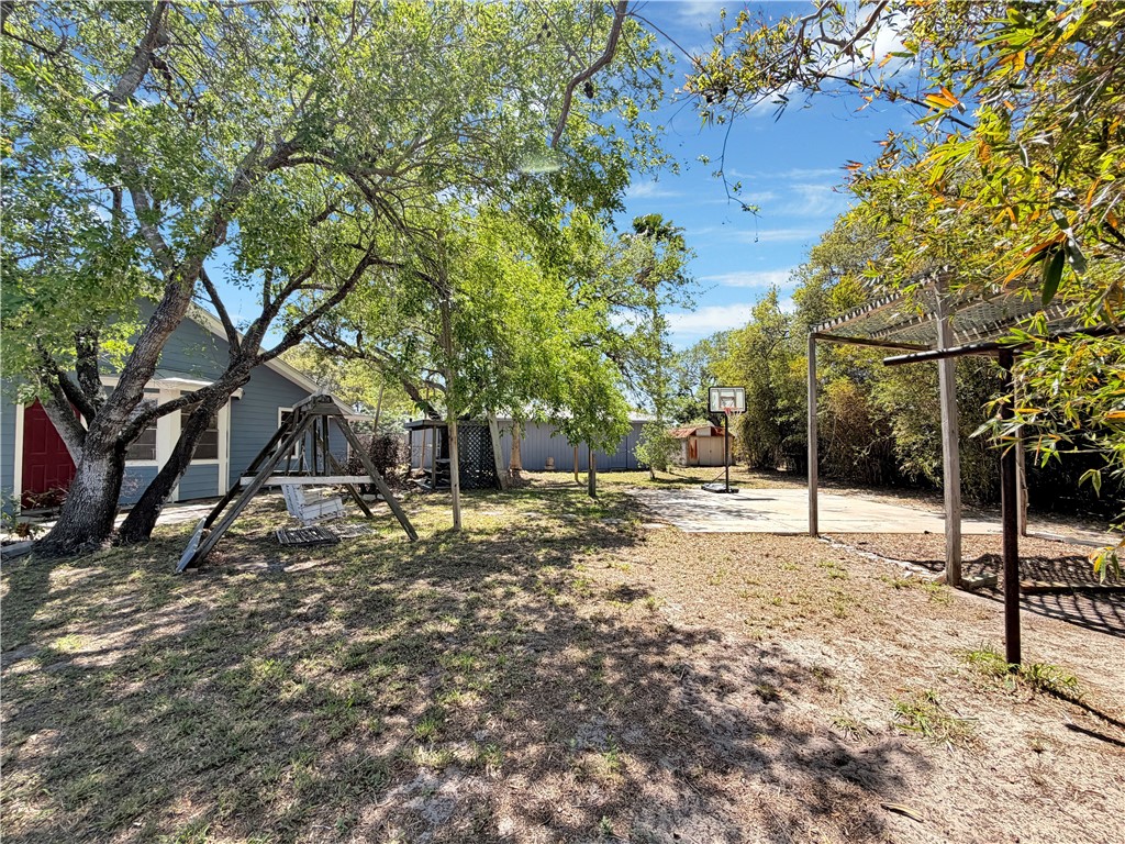 910 Twite Circle Corpus Christi, TX 78418 - Photo 34 of 40 a view of a yard with a tree