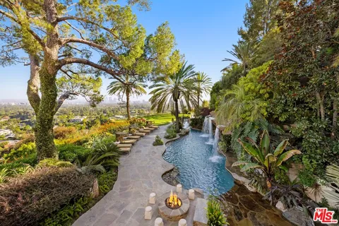 a view of kitchen with granite countertop lots of counter top space