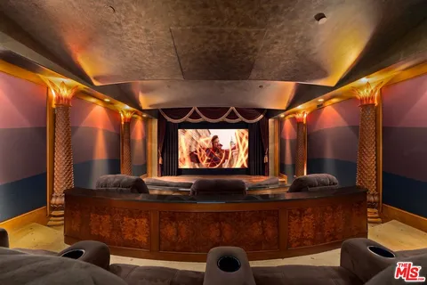 a view of a swimming pool with a table and chairs