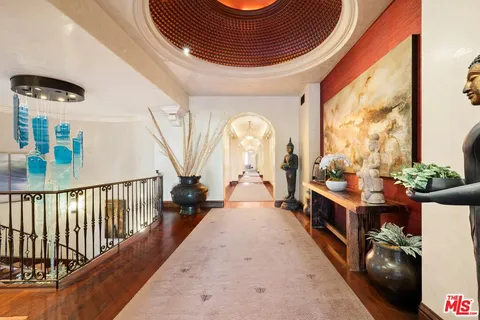 a bed room with a bed and a potted plant