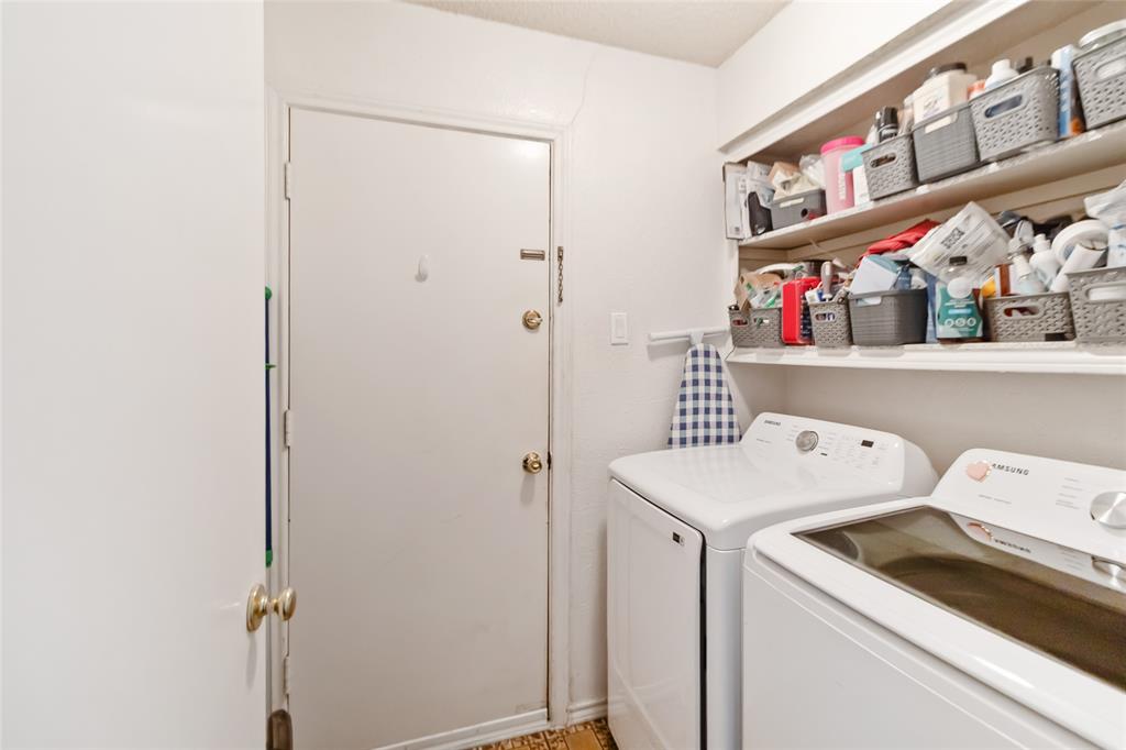 1920 Avignon Court Carrollton, TX 75007 - Photo 23 of 31 Laundry area with separate washer and dryer
