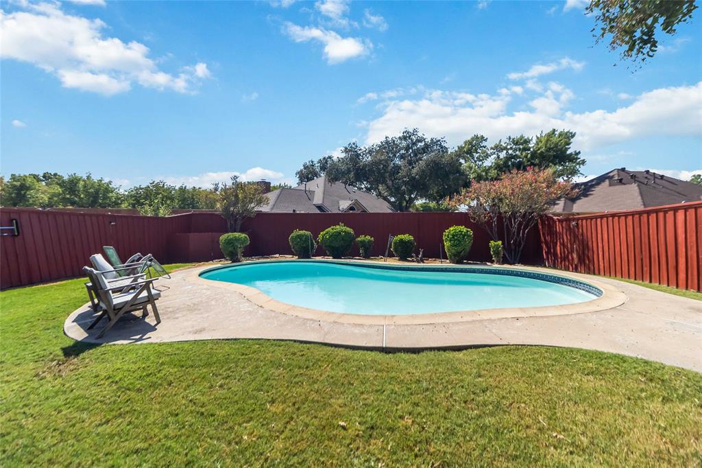 1920 Avignon Court Carrollton, TX 75007 - Photo 25 of 31 View of swimming pool with a fenced backyard and a patio