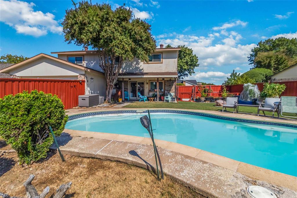 1920 Avignon Court Carrollton, TX 75007 - Photo 26 of 31 View of swimming pool with a patio and a fenced backyard