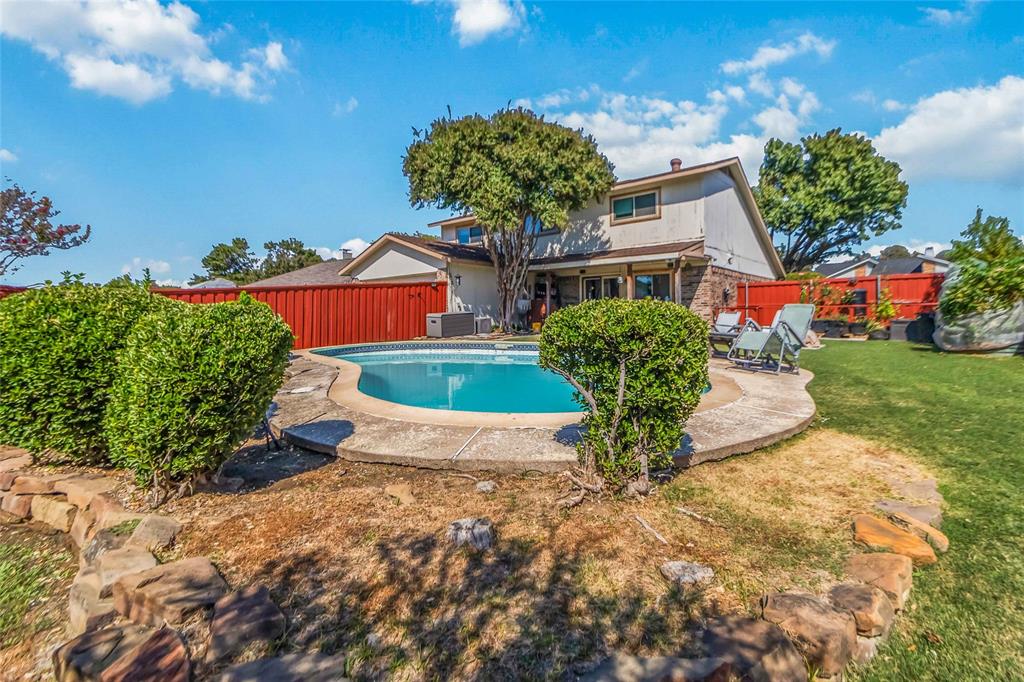1920 Avignon Court Carrollton, TX 75007 - Photo 27 of 31 View of swimming pool featuring a fenced backyard and a patio