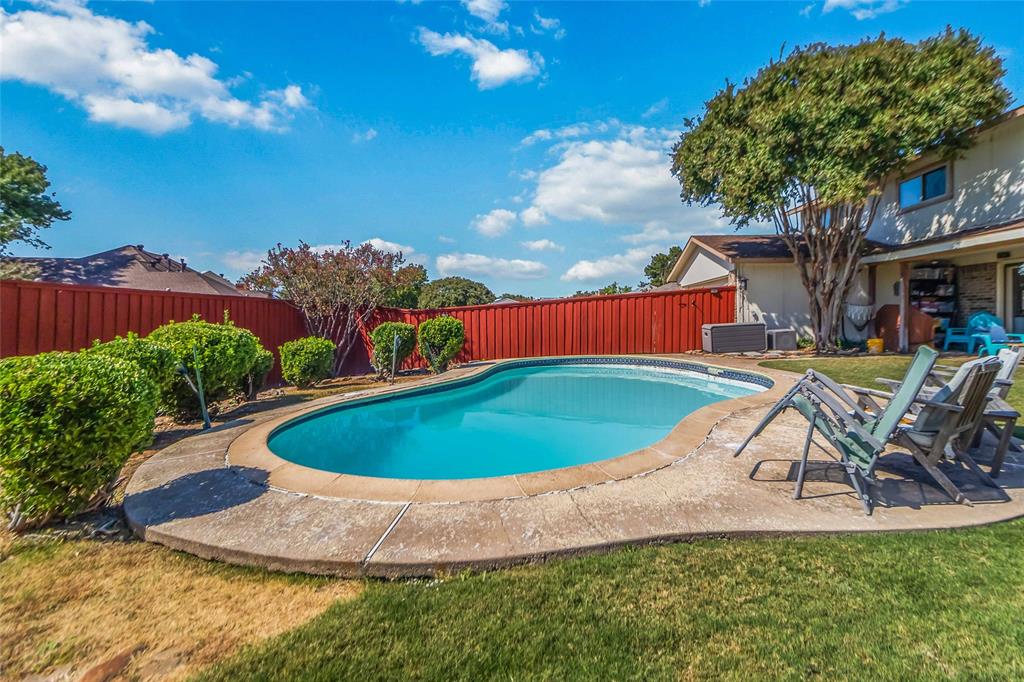 1920 Avignon Court Carrollton, TX 75007 - Photo 28 of 31 View of pool featuring a patio area and a fenced backyard