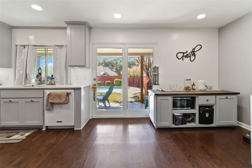 1920 Avignon Court Carrollton, TX 75007 - Photo 6 of 31 Bar with gray cabinets, recessed lighting, white dishwasher, dark wood-style flooring, and stainless steel microwave