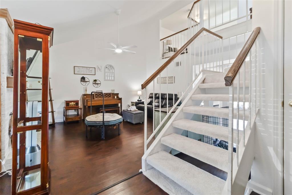 1920 Avignon Court Carrollton, TX 75007 - Photo 7 of 31 Staircase with wood finished floors and a ceiling fan