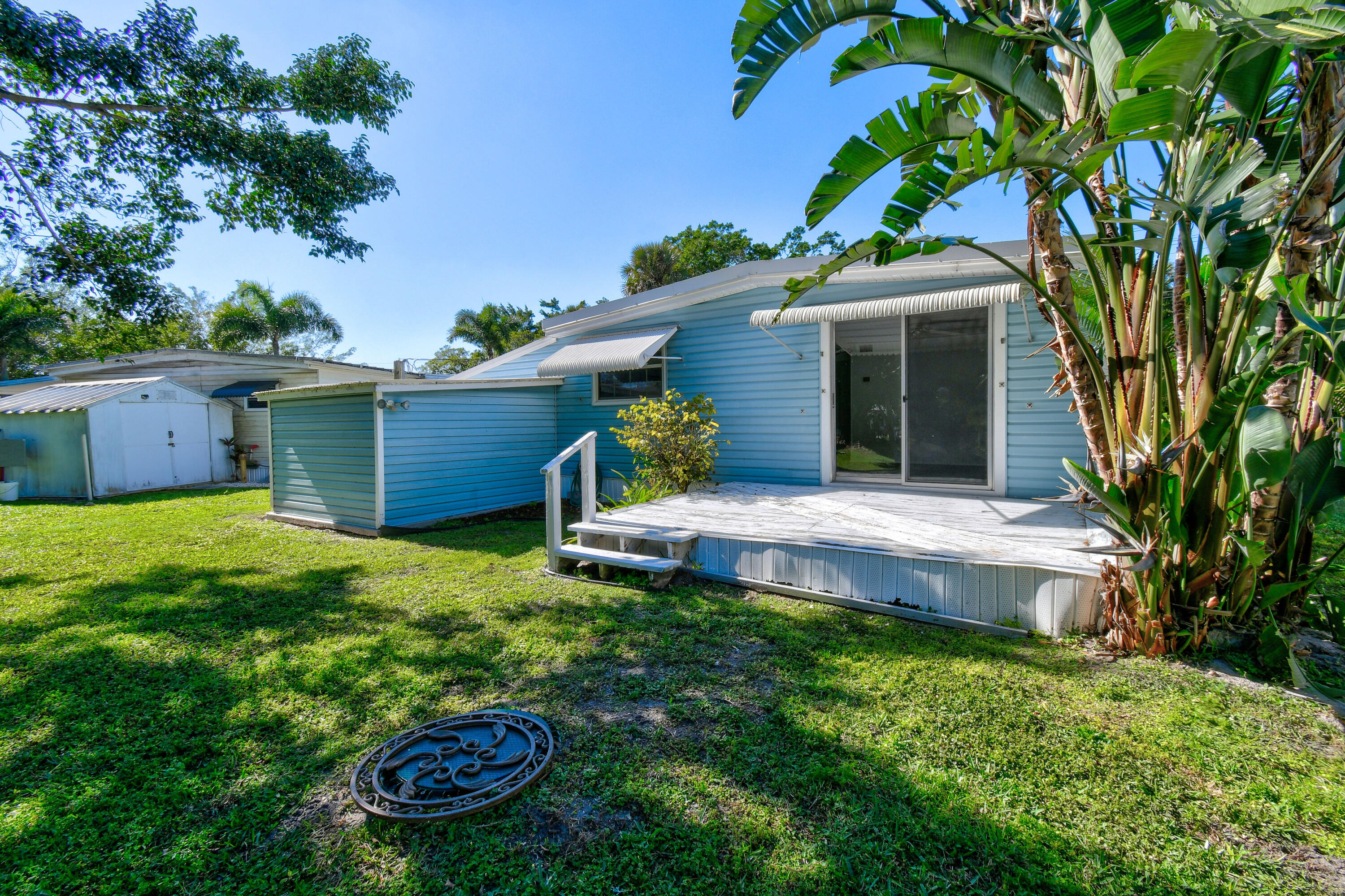 24 Southeast Fork Terrace Stuart, FL 34997 - Photo 14 of 14 a view of a backyard with a garden and plants