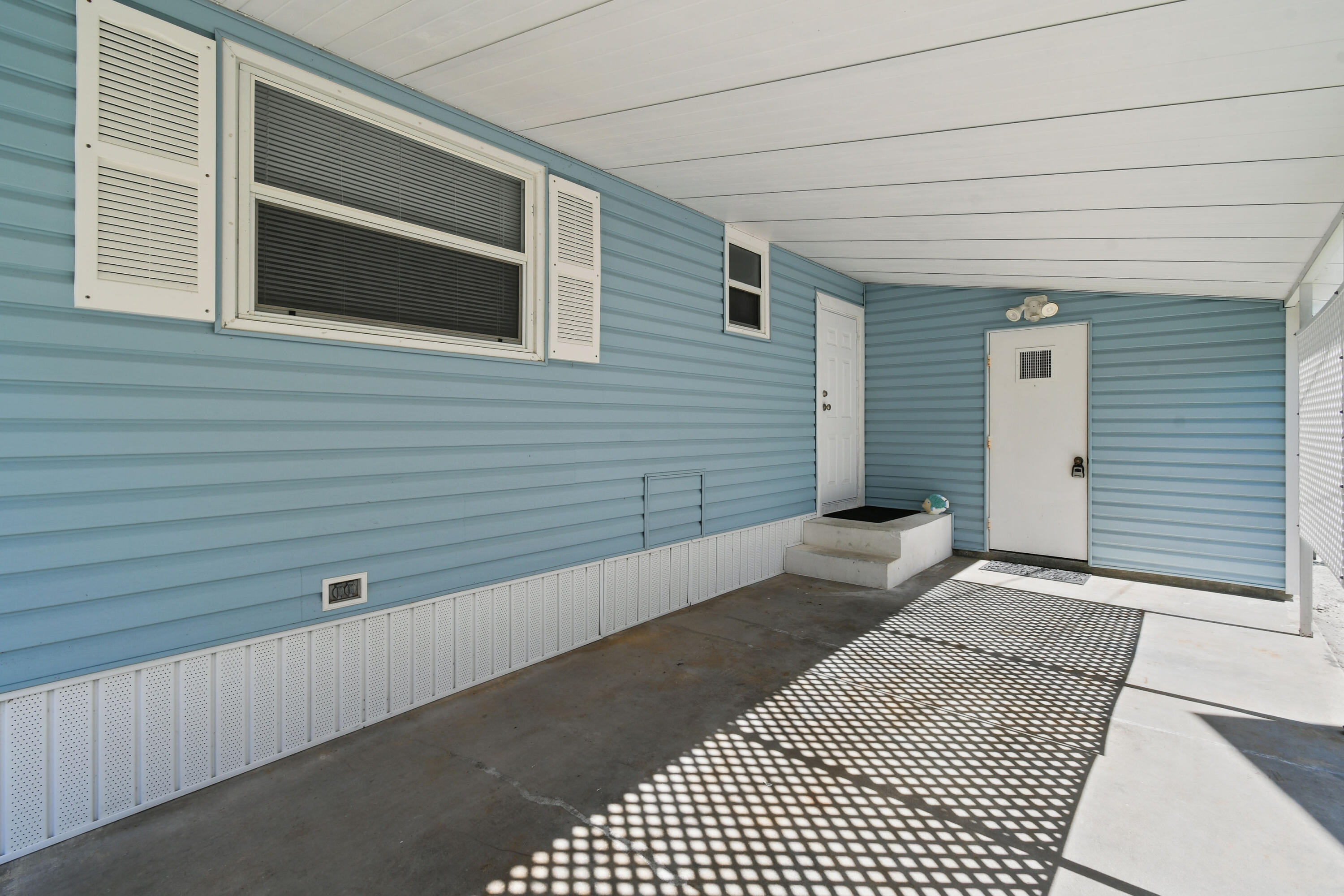 24 Southeast Fork Terrace Stuart, FL 34997 - Photo 5 of 14 a view of a street with wooden fence
