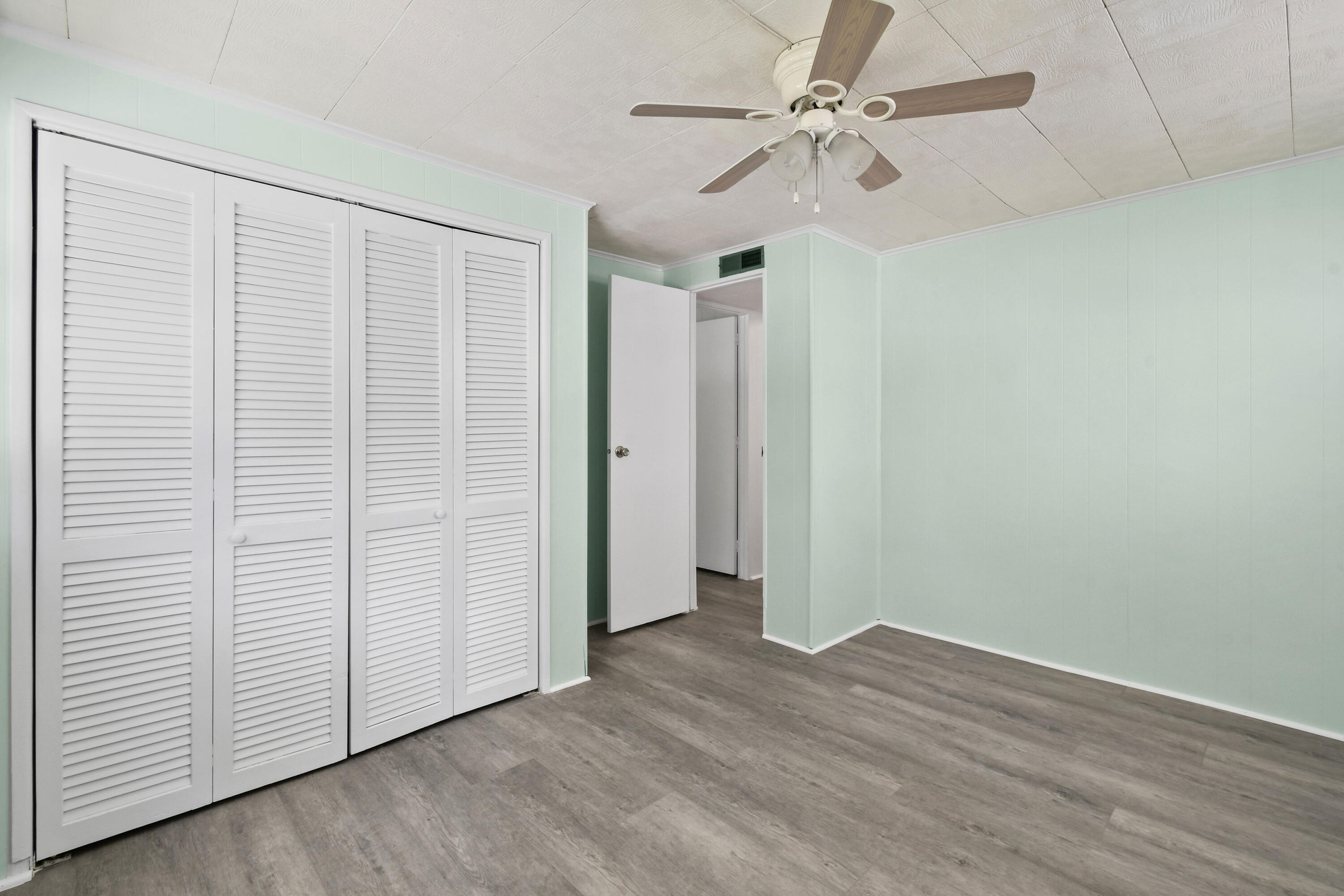 24 Southeast Fork Terrace Stuart, FL 34997 - Photo 10 of 14 wooden floor in an empty room