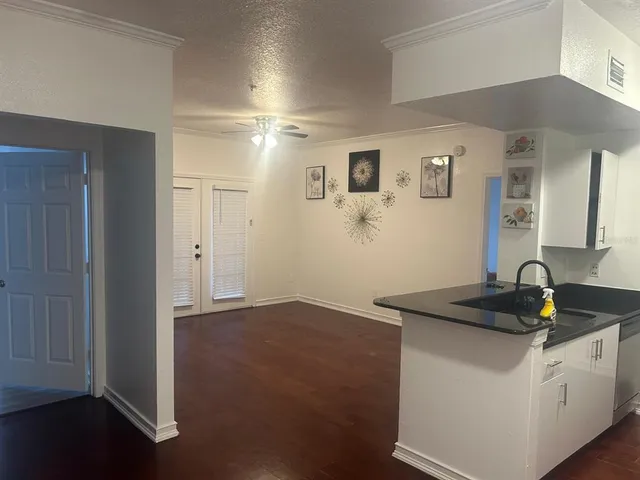 a kitchen with a sink and cabinets