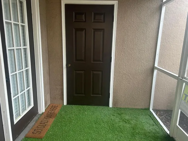 an aerial view of a house a yard swimming pool and outdoor seating
