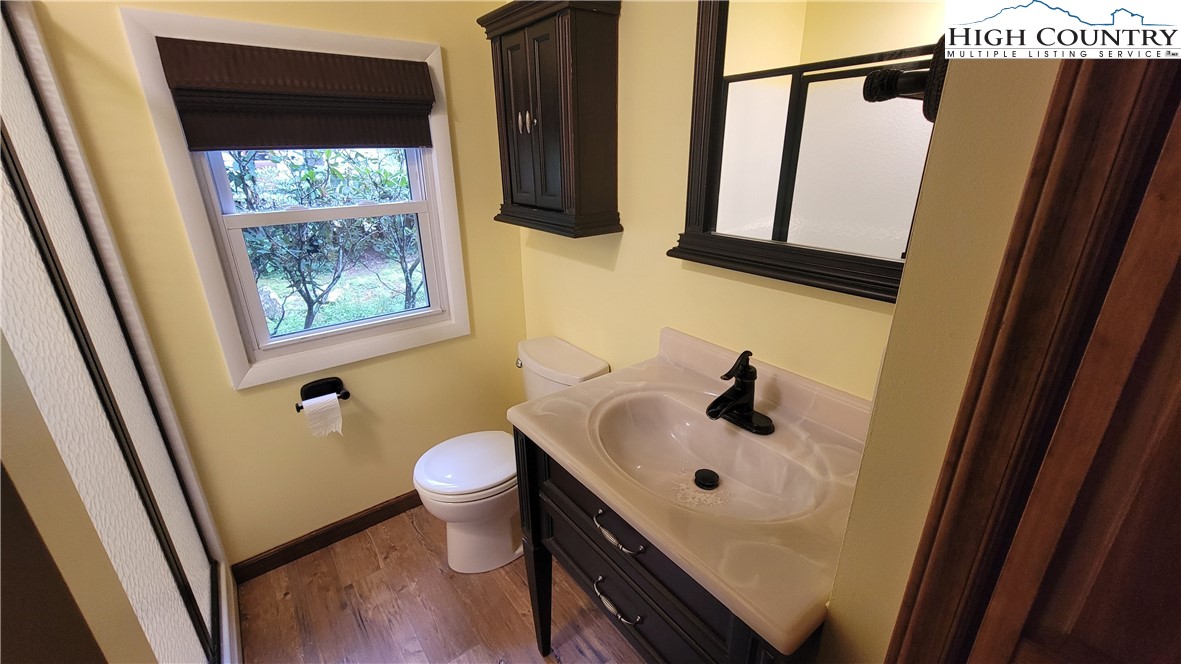 252 Goshen Creek Lane Boone, NC 28607 - Photo 13 of 31 a bathroom with a sink and a mirror