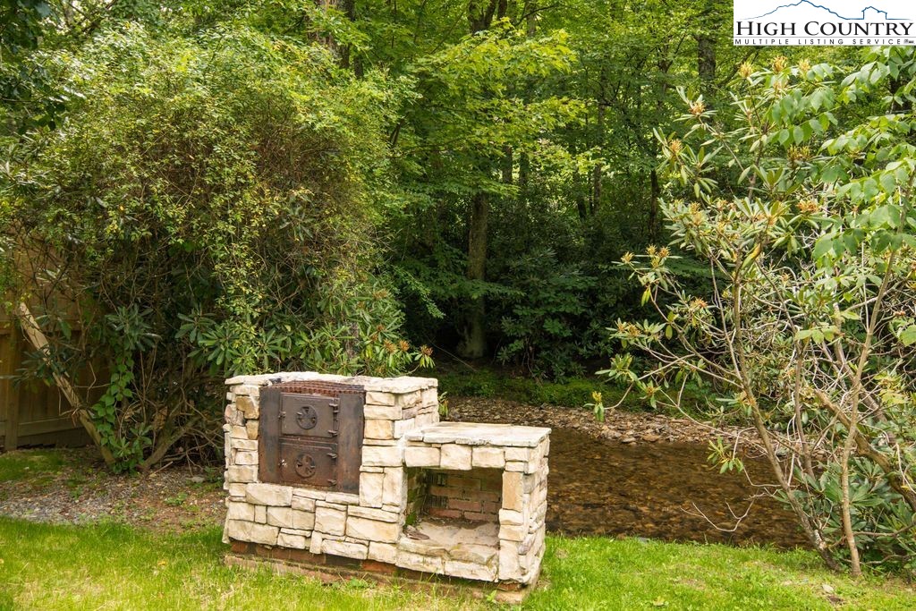 252 Goshen Creek Lane Boone, NC 28607 - Photo 17 of 31 a view of a yard with an outdoor seating