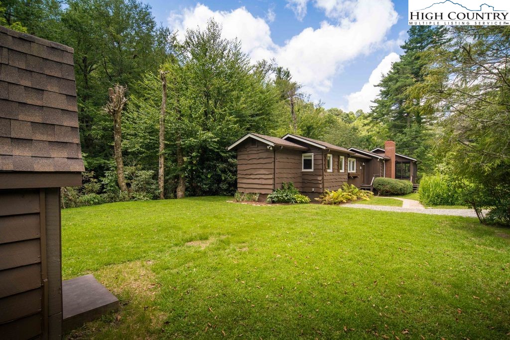 252 Goshen Creek Lane Boone, NC 28607 - Photo 19 of 31 a front view of house with yard and green space
