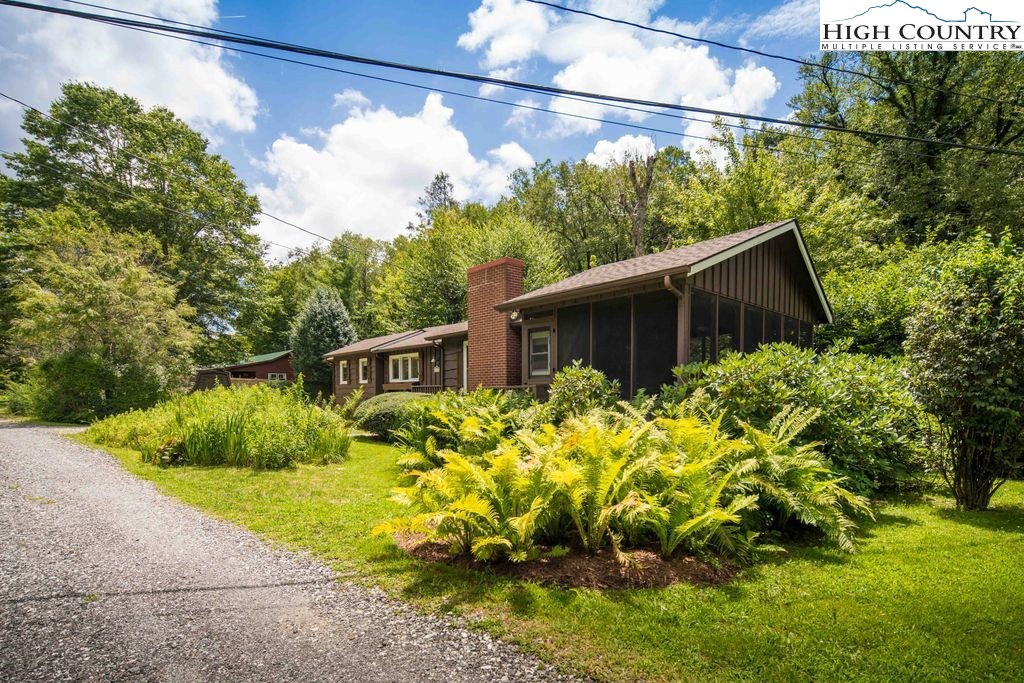 252 Goshen Creek Lane Boone, NC 28607 - Photo 22 of 31 a view of a house with a yard