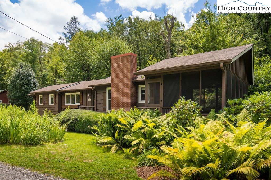252 Goshen Creek Lane Boone, NC 28607 - Photo 25 of 31 a front view of a house with a yard