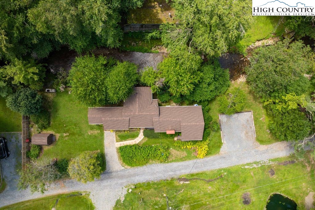 252 Goshen Creek Lane Boone, NC 28607 - Photo 27 of 31 an aerial view of a house with a yard basket ball court and outdoor seating