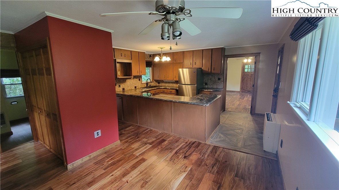 252 Goshen Creek Lane Boone, NC 28607 - Photo 5 of 31 a kitchen with stainless steel appliances granite countertop a refrigerator and a sink