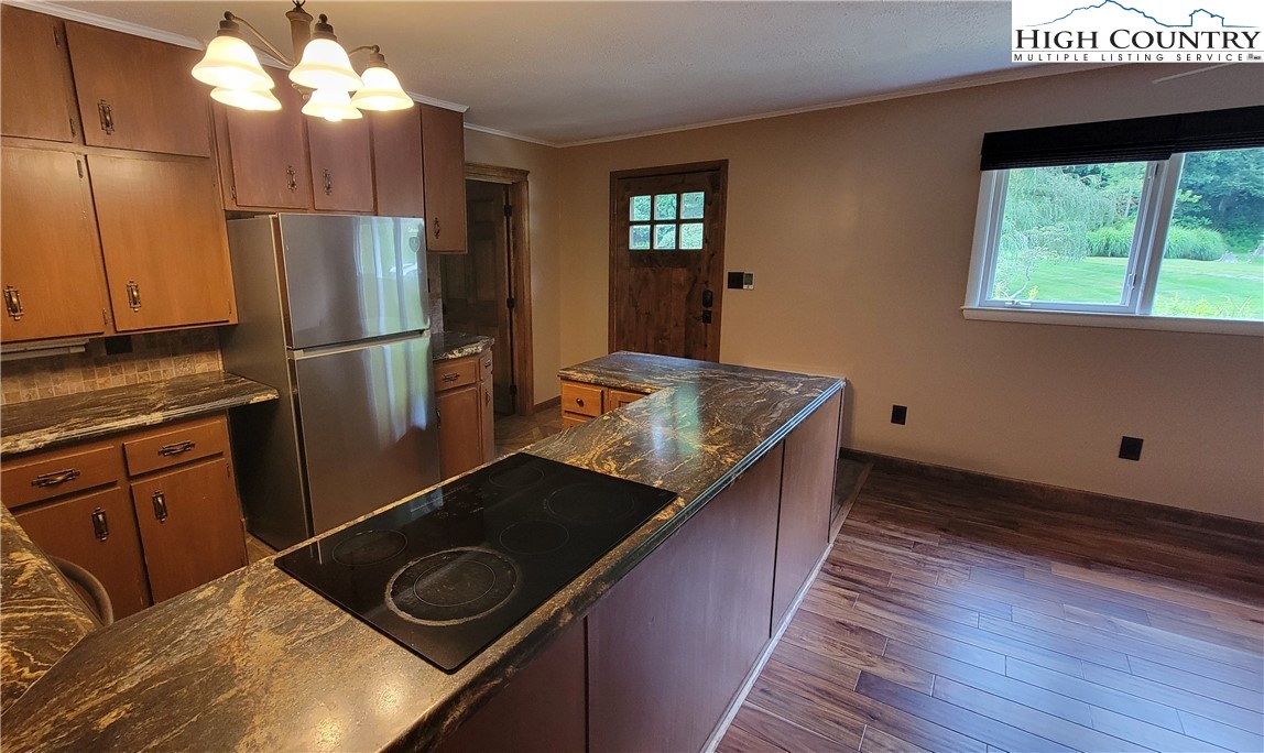 252 Goshen Creek Lane Boone, NC 28607 - Photo 7 of 31 a kitchen with a sink stove and refrigerator