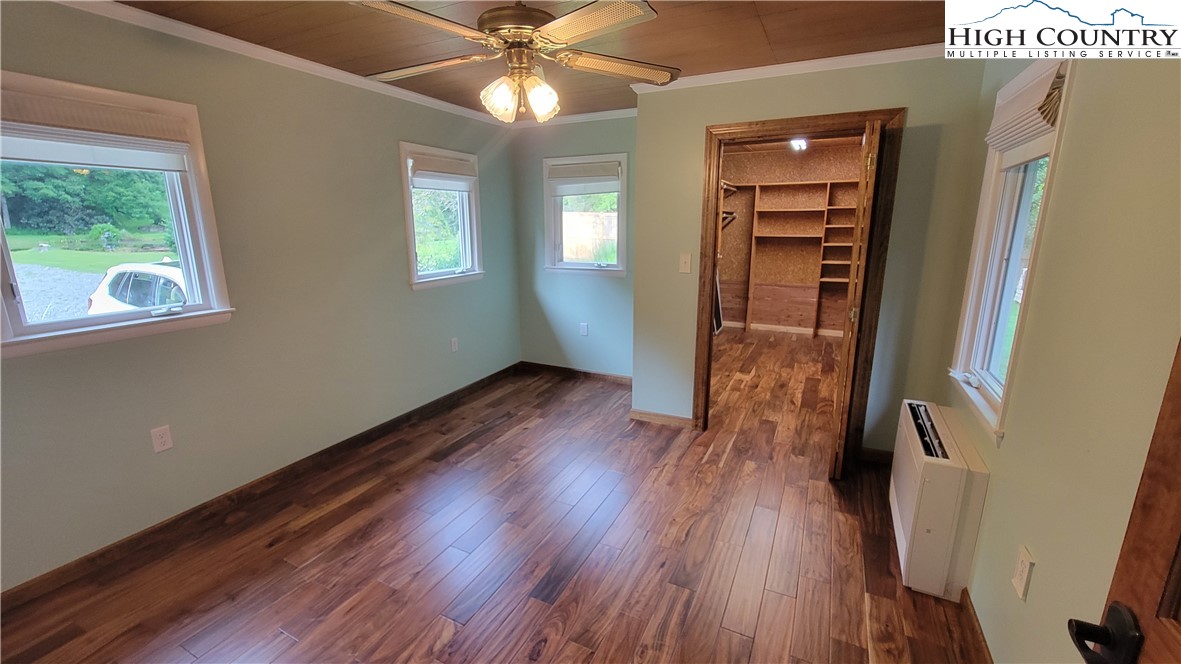 252 Goshen Creek Lane Boone, NC 28607 - Photo 9 of 31 wooden floor in an empty room with a window