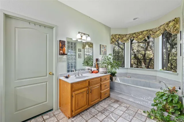 a view of a bathroom with dual sinks