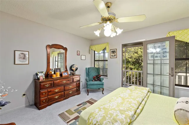 a bed room with a bed and a chandelier