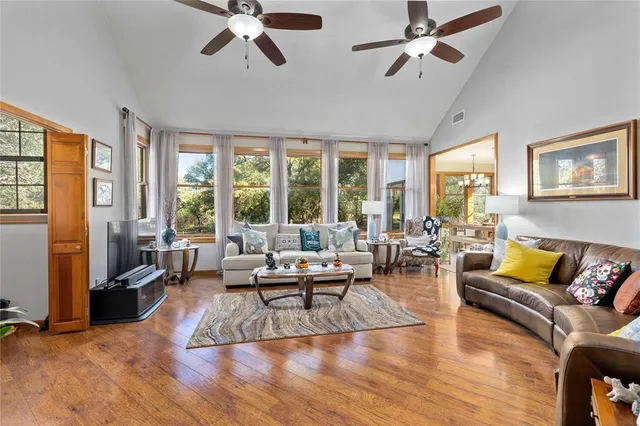 a living room with furniture or couches and a large window