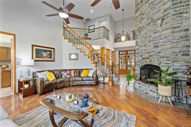 a living room with furniture and fireplace