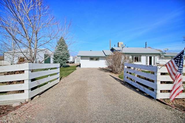 1634 O Road Loma, CO 81524 - Photo 10 of 39 a front view of a house with a yard