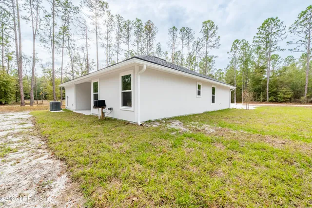 a house with trees in the background