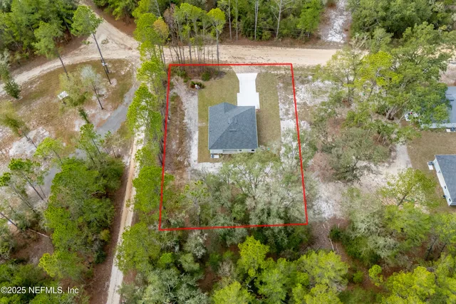 a kitchen with stainless steel appliances granite countertop a refrigerator a oven a sink and white cabinets with wooden floor