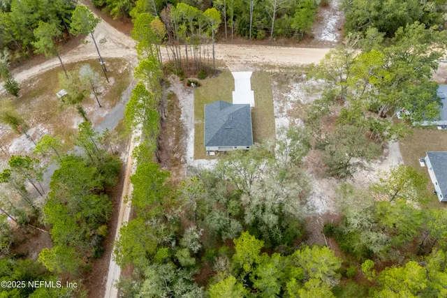 a large kitchen with stainless steel appliances granite countertop a lot of counter space and wooden floors