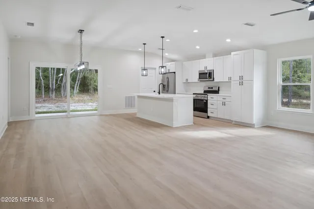 a view of an empty room with a window