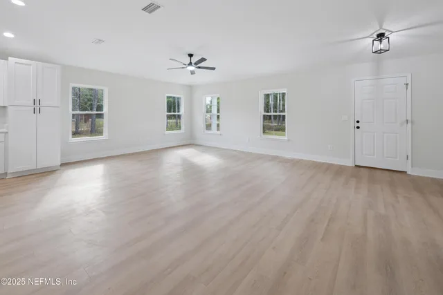 a bathroom with double vanity sink a mirror and shower