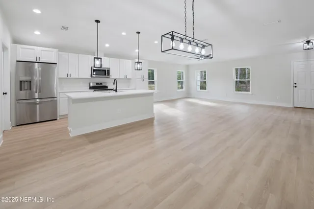 a bathroom with a double vanity sink and mirror