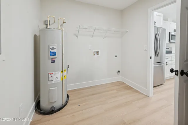 a bathroom with a double vanity sink a mirror and a shower